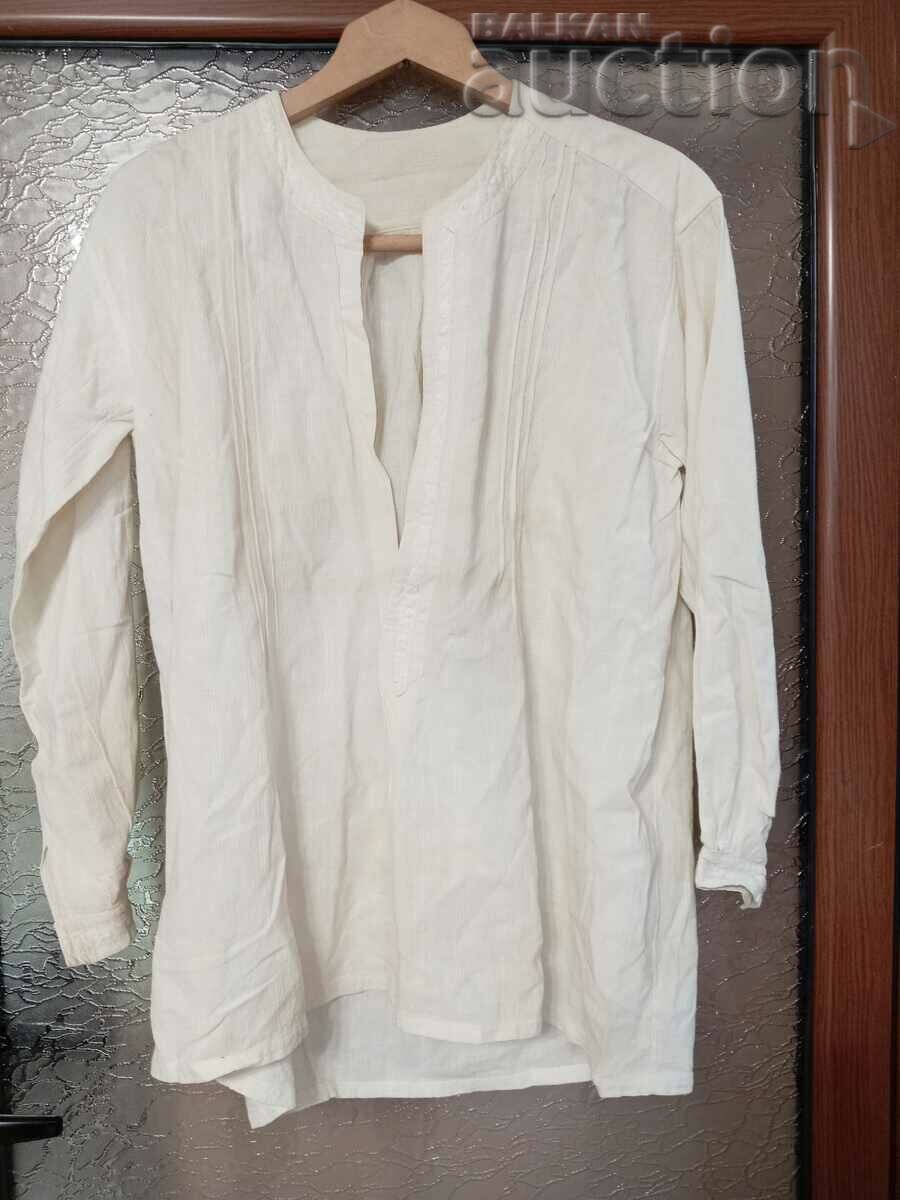 Old men's fringed shirt handmade in antiquity