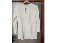 Old men's fringed shirt handmade in antiquity