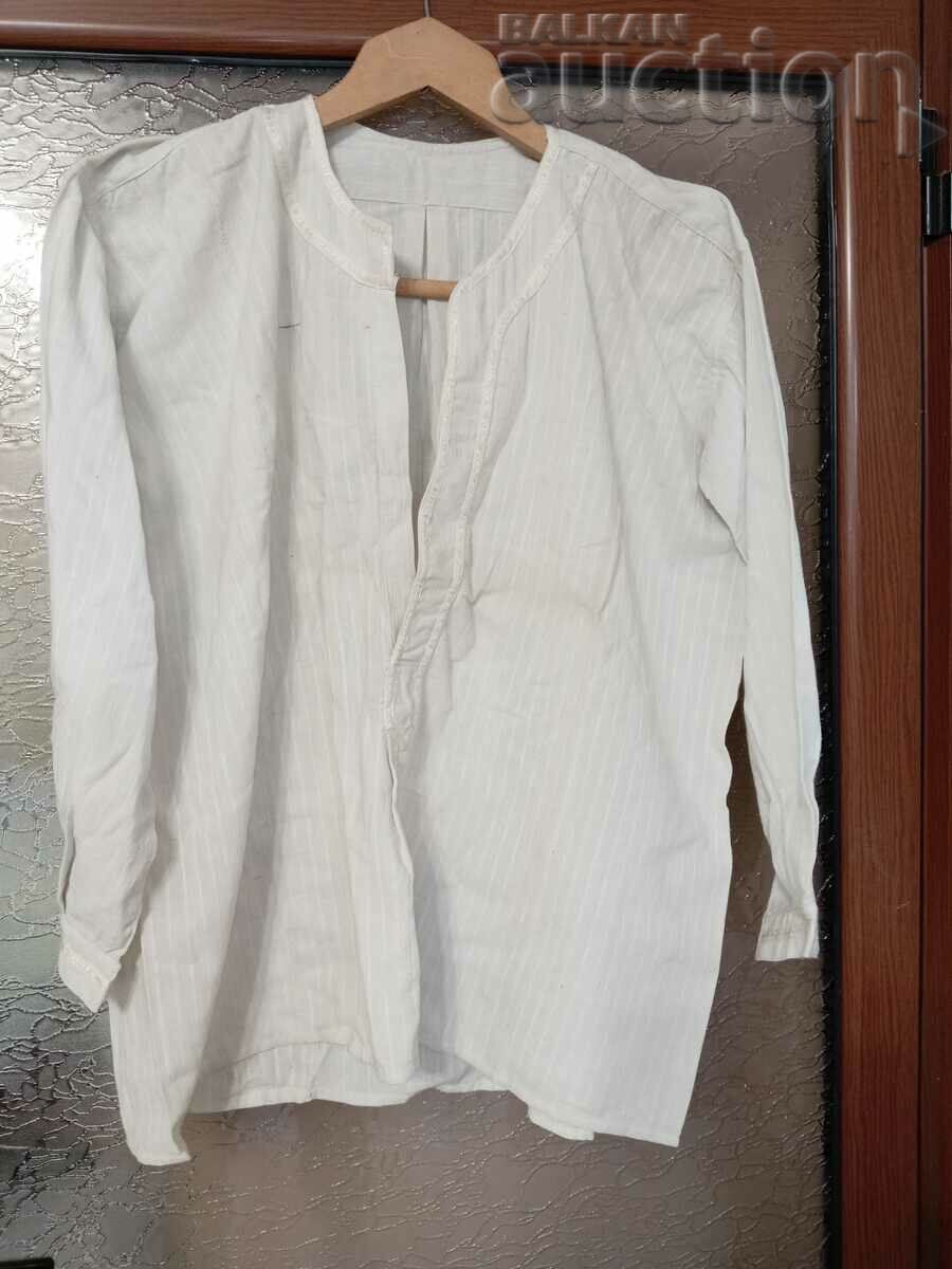 Old men's fringed shirt handmade in antiquity