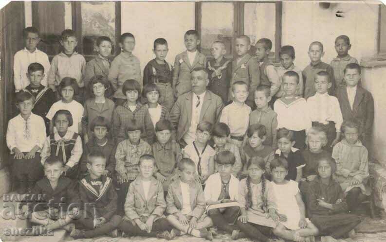 Old photo, beginning. in the 20th century, children, students, teacher