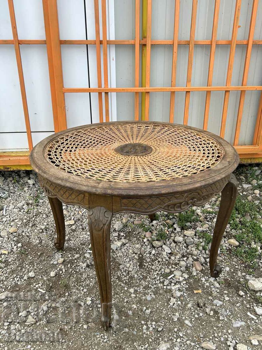 Living room round table with rattan top and wood carving