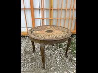 Living room round table with rattan top and wood carving