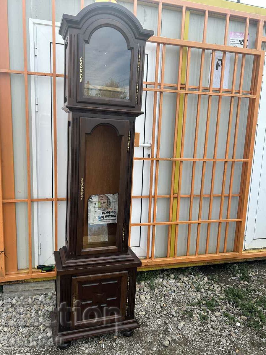 A beautiful wooden box for a parquet clock with bronze elements