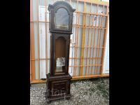 A beautiful wooden box for a parquet clock with bronze elements