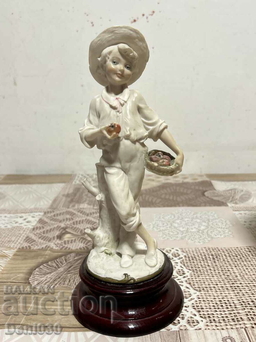 Figure statuette made of a special type of plastic with markings