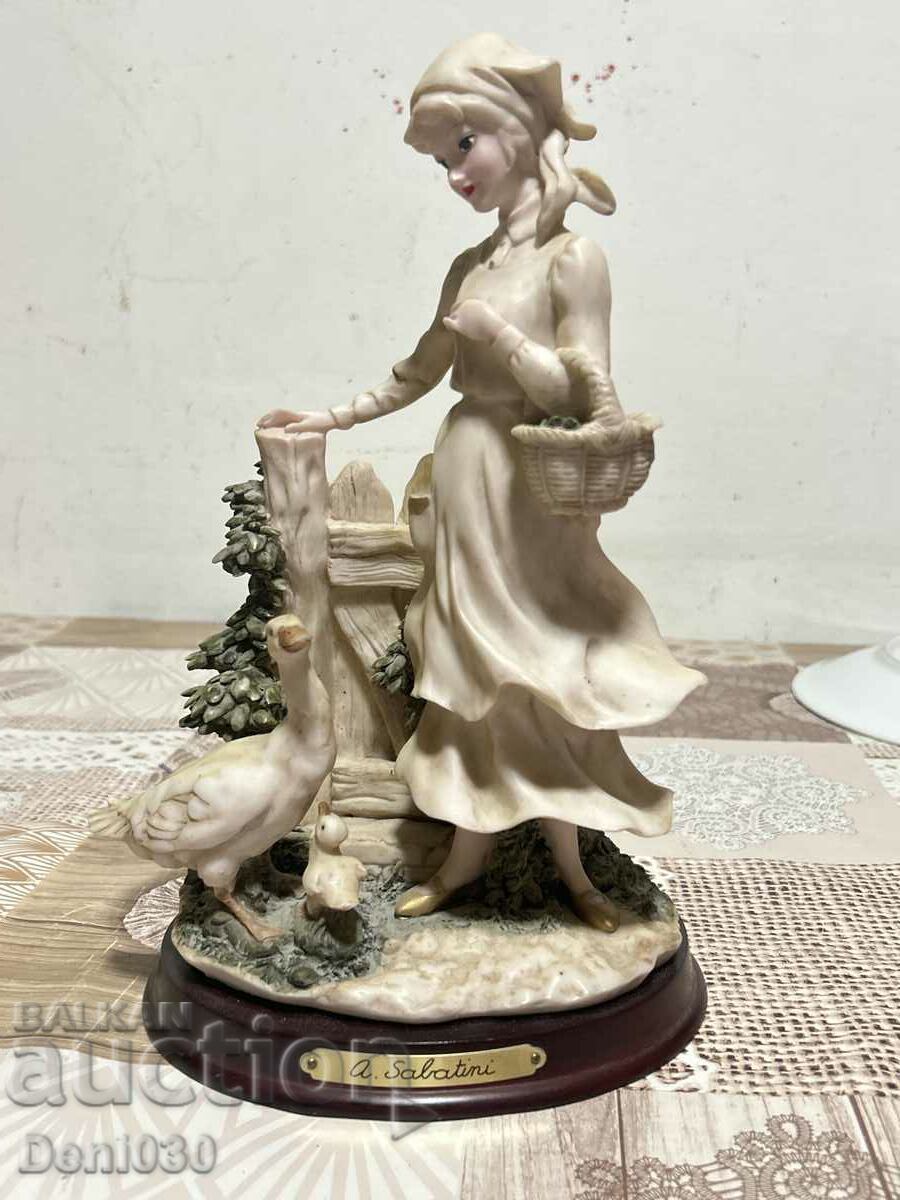 A beautiful statuette figure with markings made of special plastic