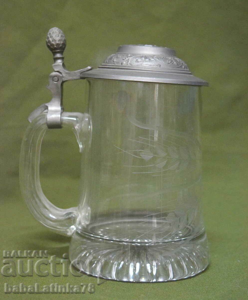 Old German glass beer mug with lid