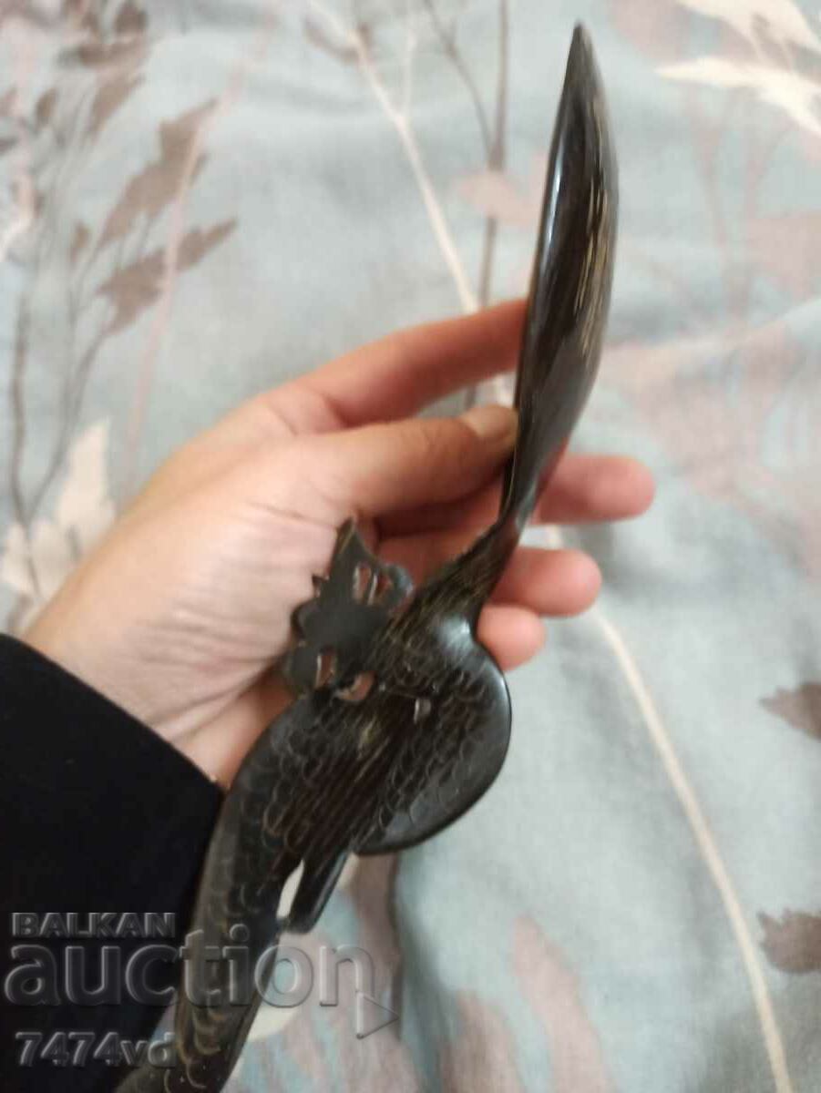 Delivery of A large spoon carved from a whole buffalo horn with a dragon