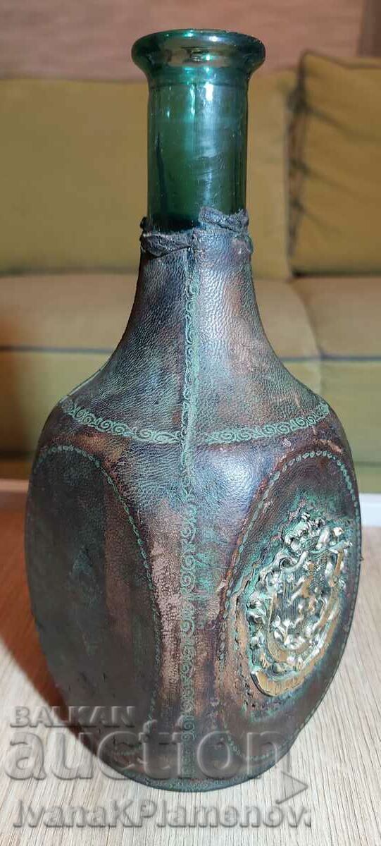 Bottle covered in vintage leather with price 12.00 BGN | € 6.14 Bottle covered in vintage leather with price 12.00 BGN | € 6.14