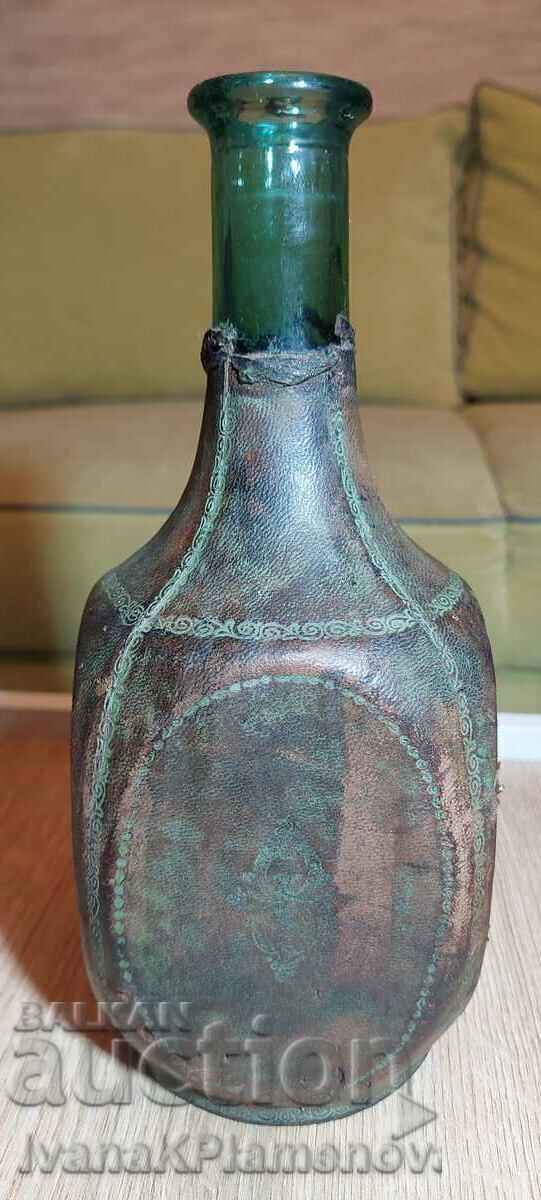 Auction Bottle covered in vintage leather Auction Bottle covered in vintage leather