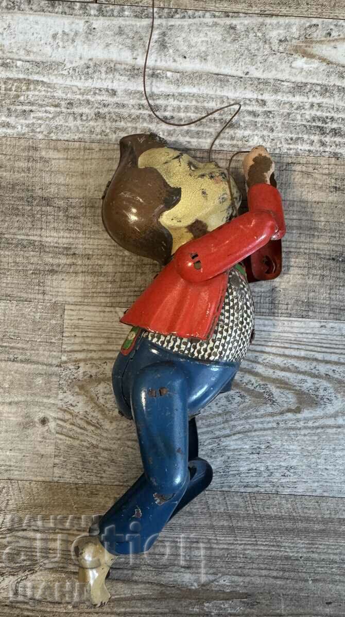 Old German Metal Mechanical Toy Climbing Boy