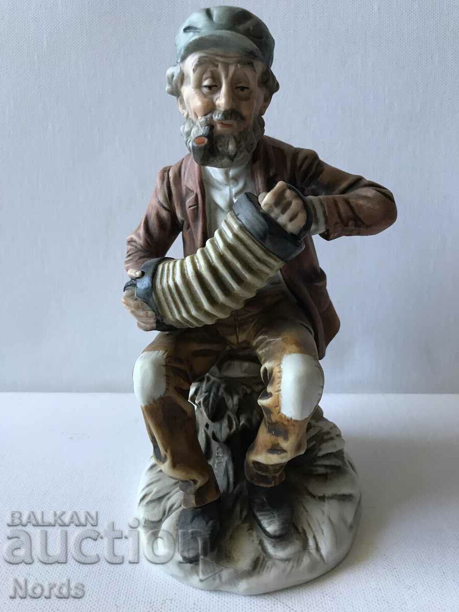 Porcelain figurine with an accordion