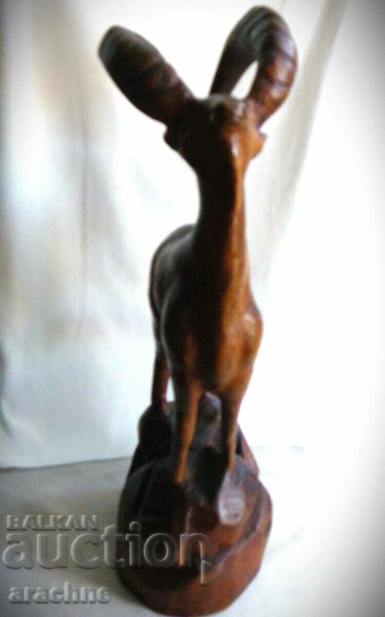 Auction  A large French wooden statue of a capricorn