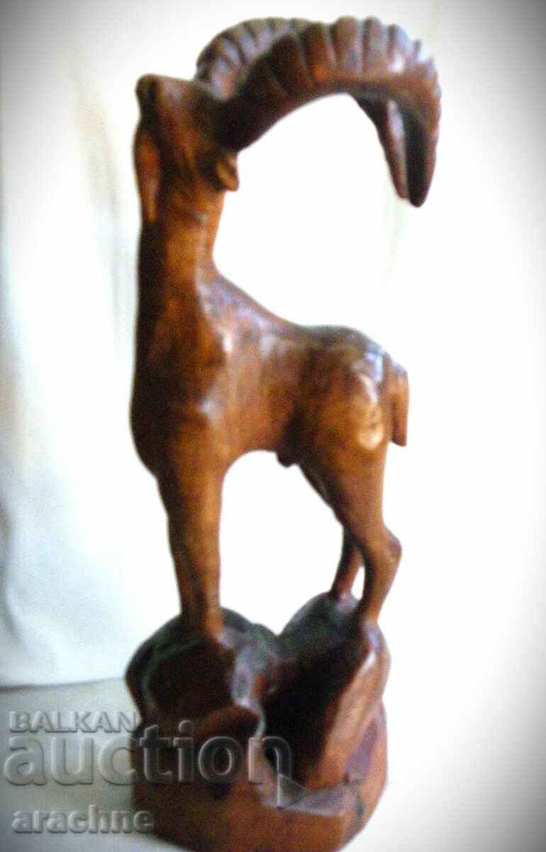 Delivery of A large French wooden statue of a capricorn