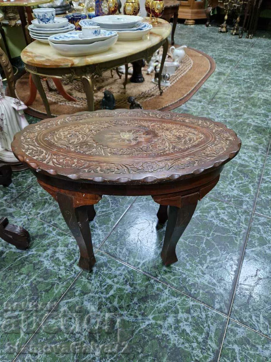 A great antique solid wood coffee table with bronze inlays