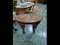 A great antique solid wood coffee table with bronze inlays