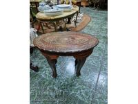 A great antique solid wood coffee table with bronze inlays