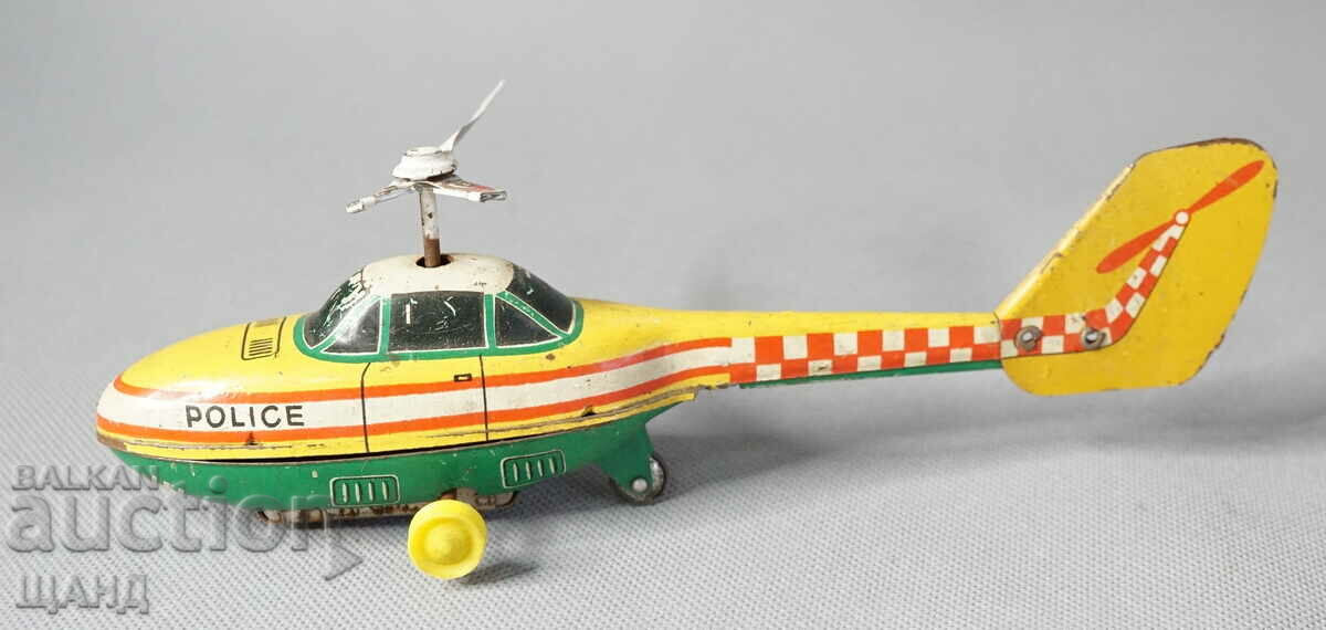 Old metal toy model helicopter police