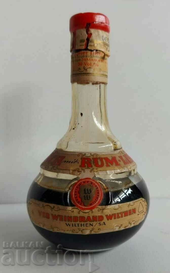 . OLD BOTTLE OF RUM HALF-FULL UNUSED . OLD BOTTLE OF RUM HALF-FULL UNUSED