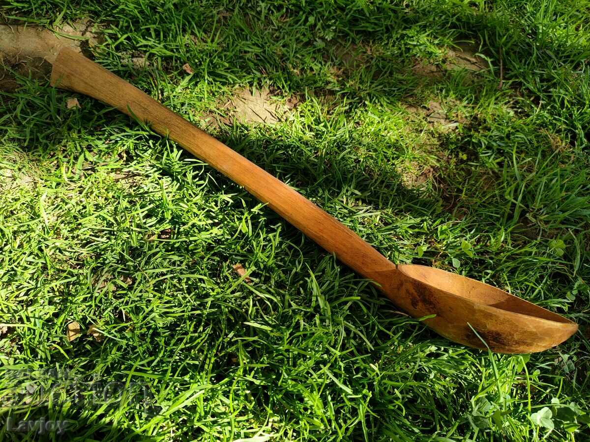 Auction A large wooden spoon Auction A large wooden spoon