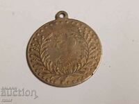 Old brass pendant for jewelry. Costumes