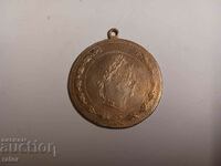 Old brass pendant for jewelry. Costumes