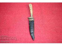 Antique knife with original leather handle.