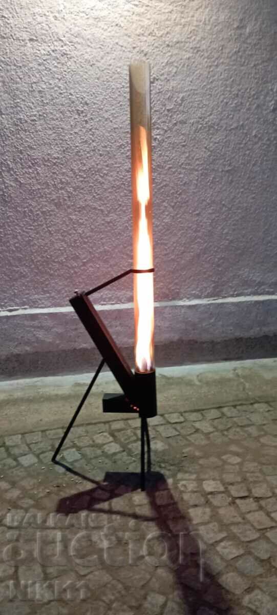 Pellet rocket stove with an open fire in a glass tube