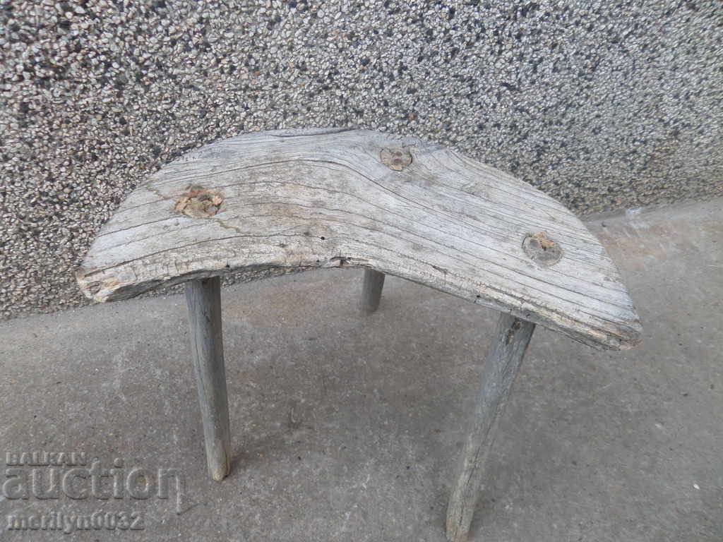 Old three-legged stool, chair, wooden, primitive