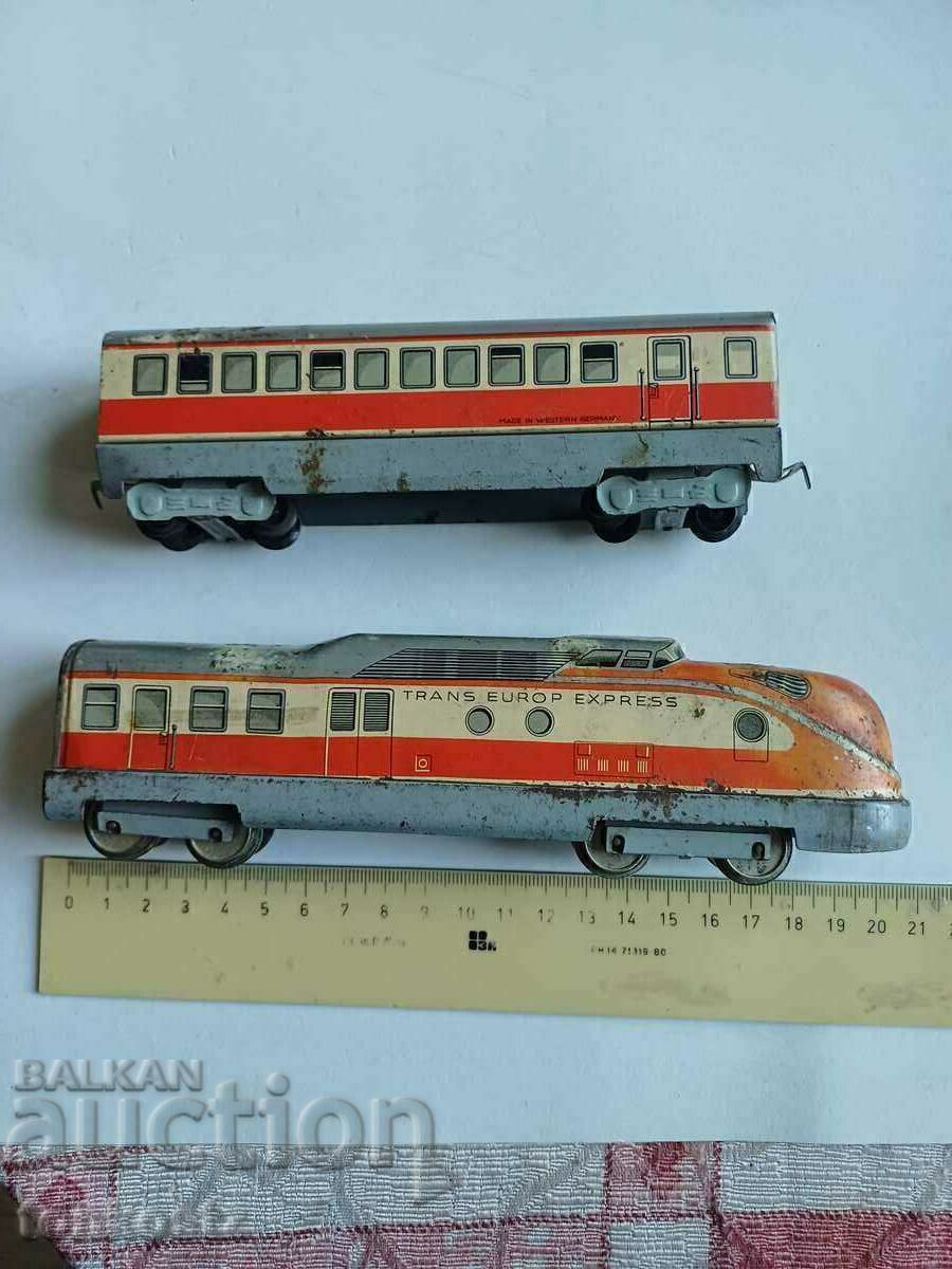 A metal train with a wagon A metal train with a wagon