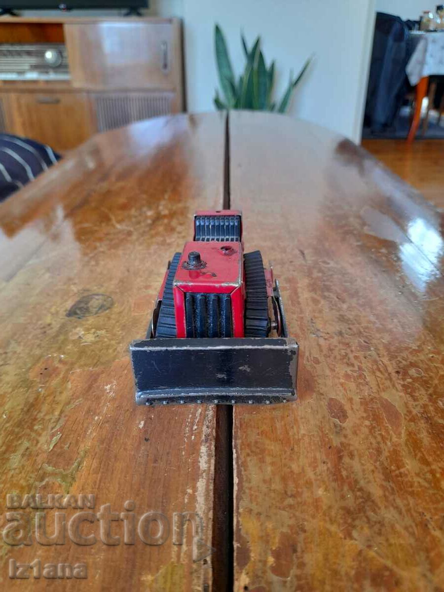 Delivery of Old toy tractor Delivery of Old toy tractor