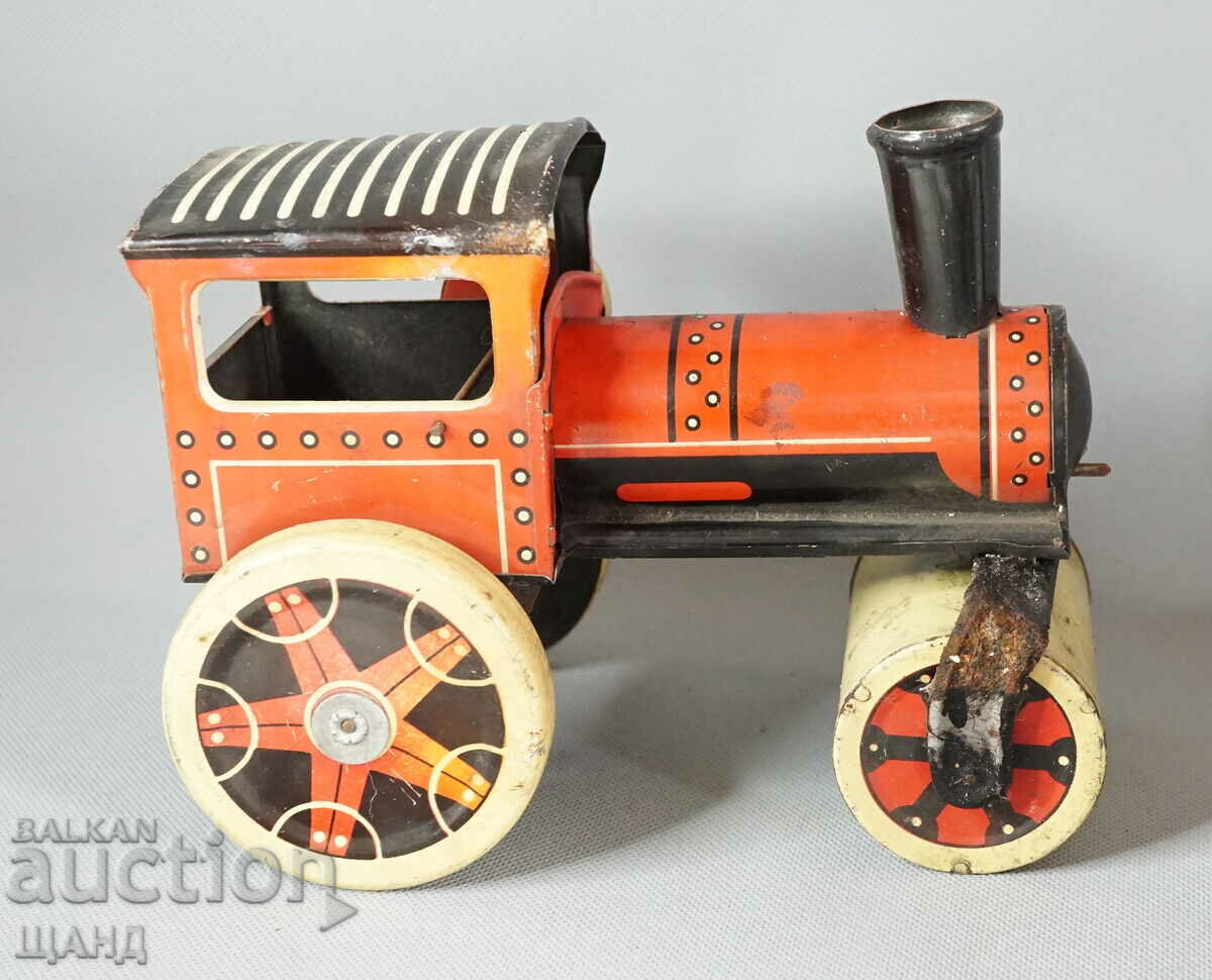 Old metal mechanical toy roller model