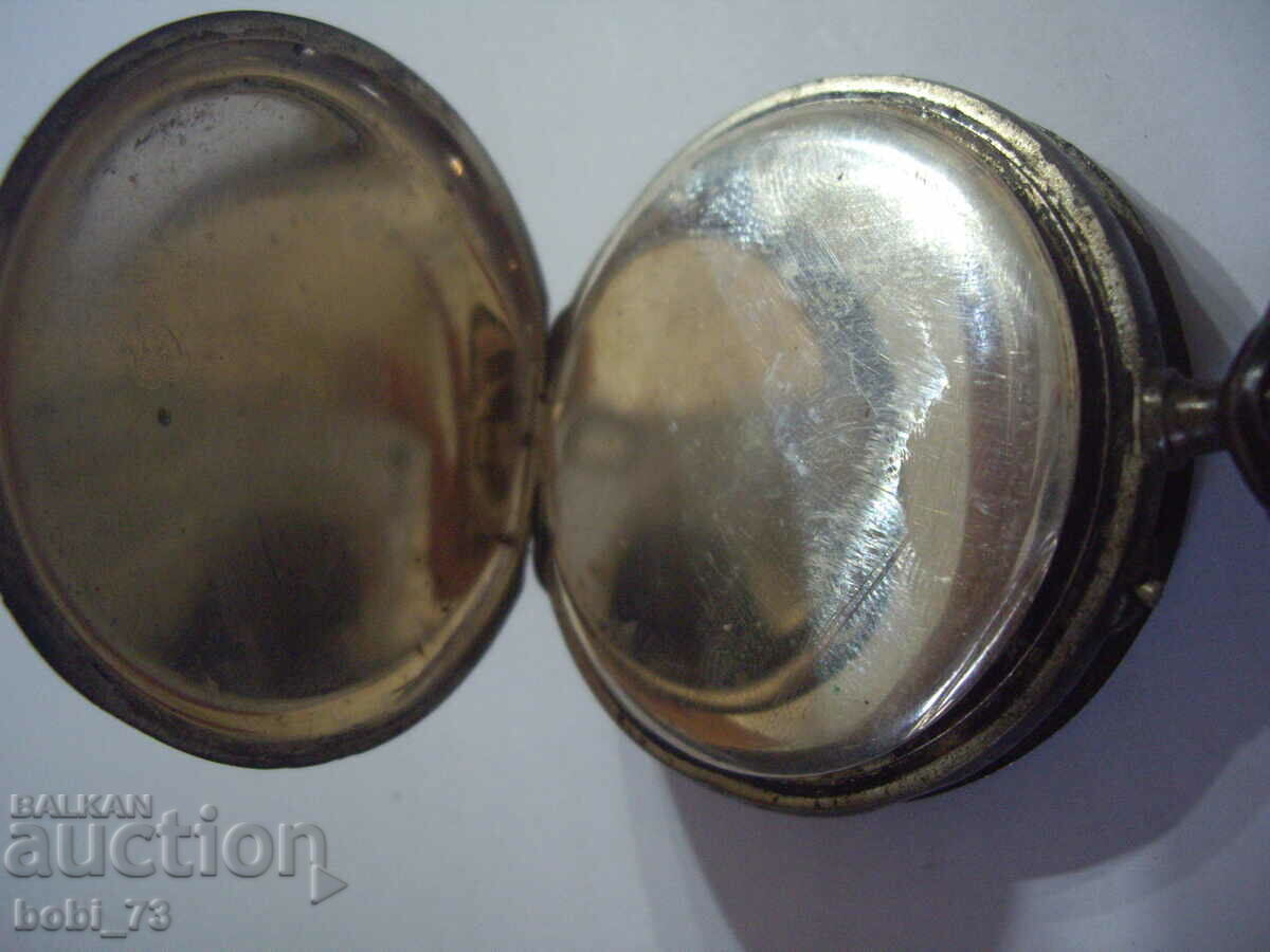 Auction An old pocket watch. Auction An old pocket watch.