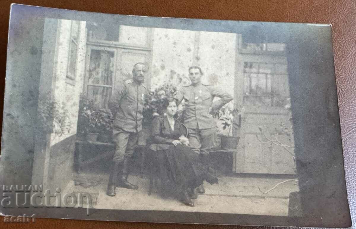 PSV Officers with medals and a lady