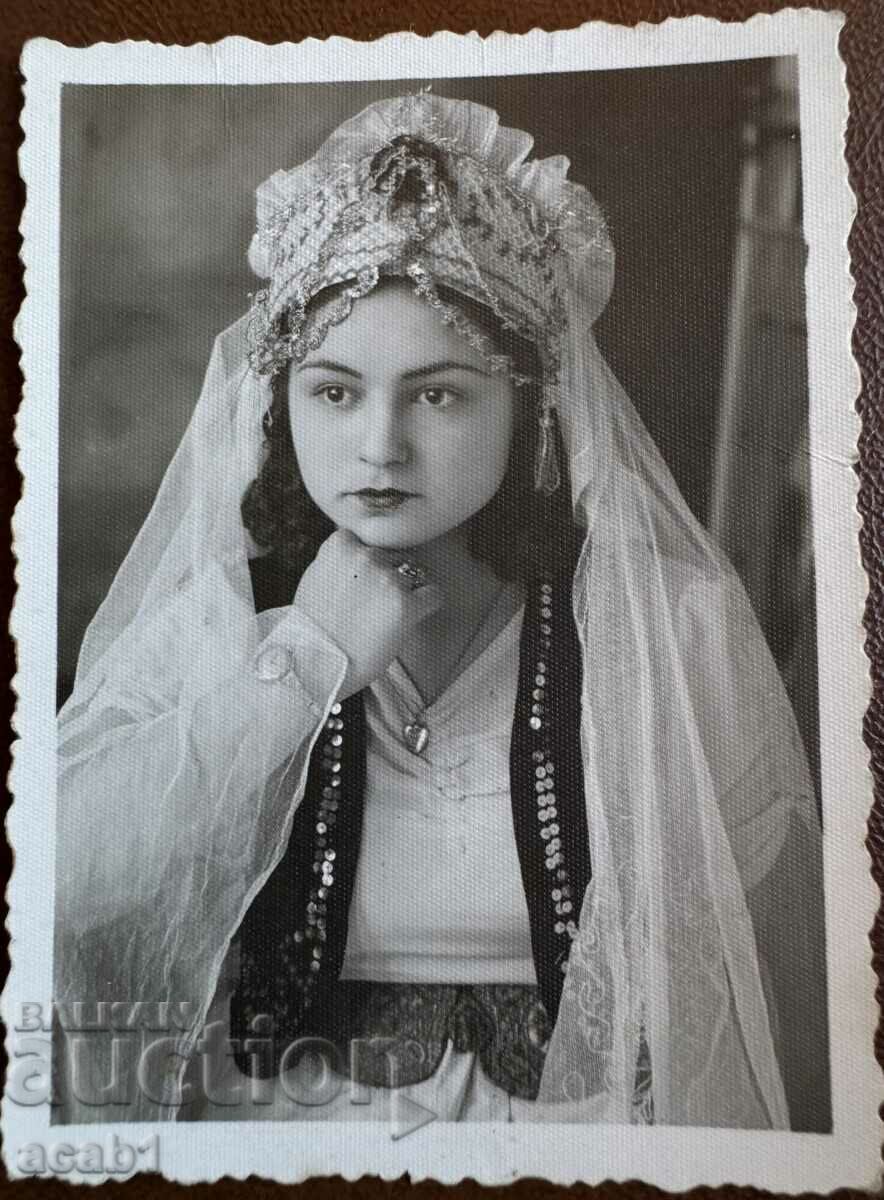 A lady in a festive dress, dressed up in Burgas