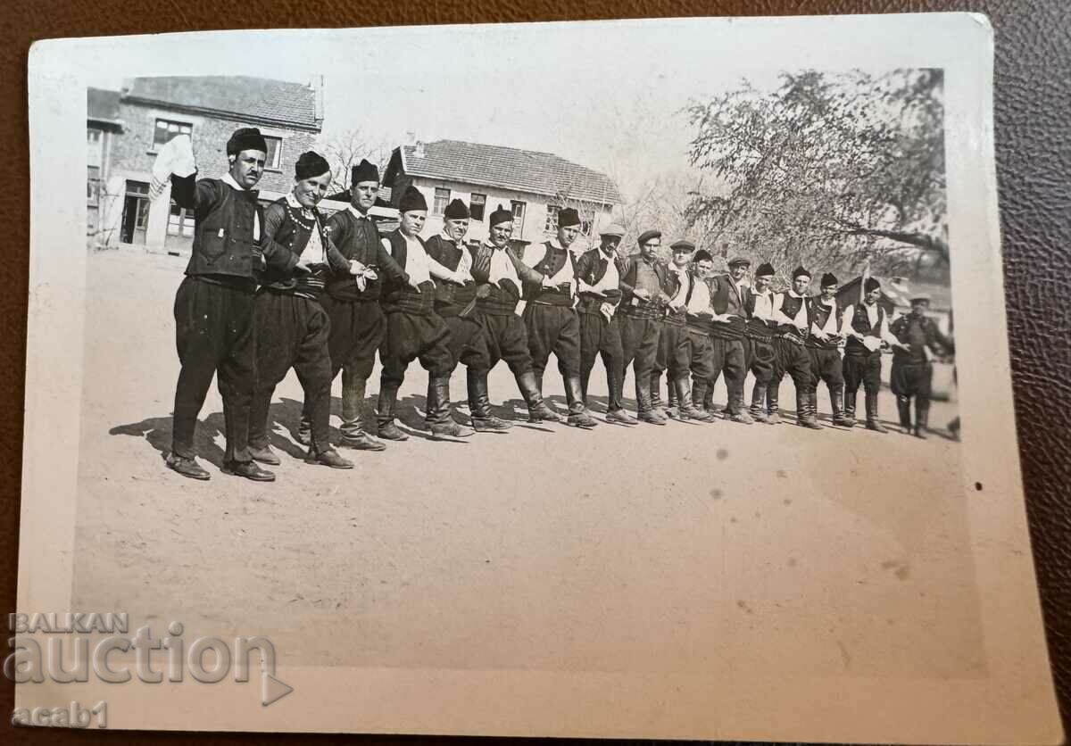 Men in costume caught dancing