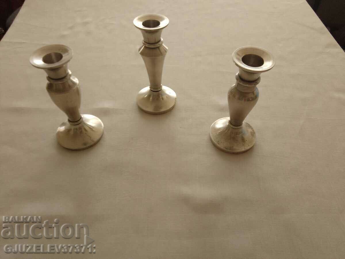 three silver-plated candlesticks for a restaurant large table three silver-plated candlesticks for a restaurant large table