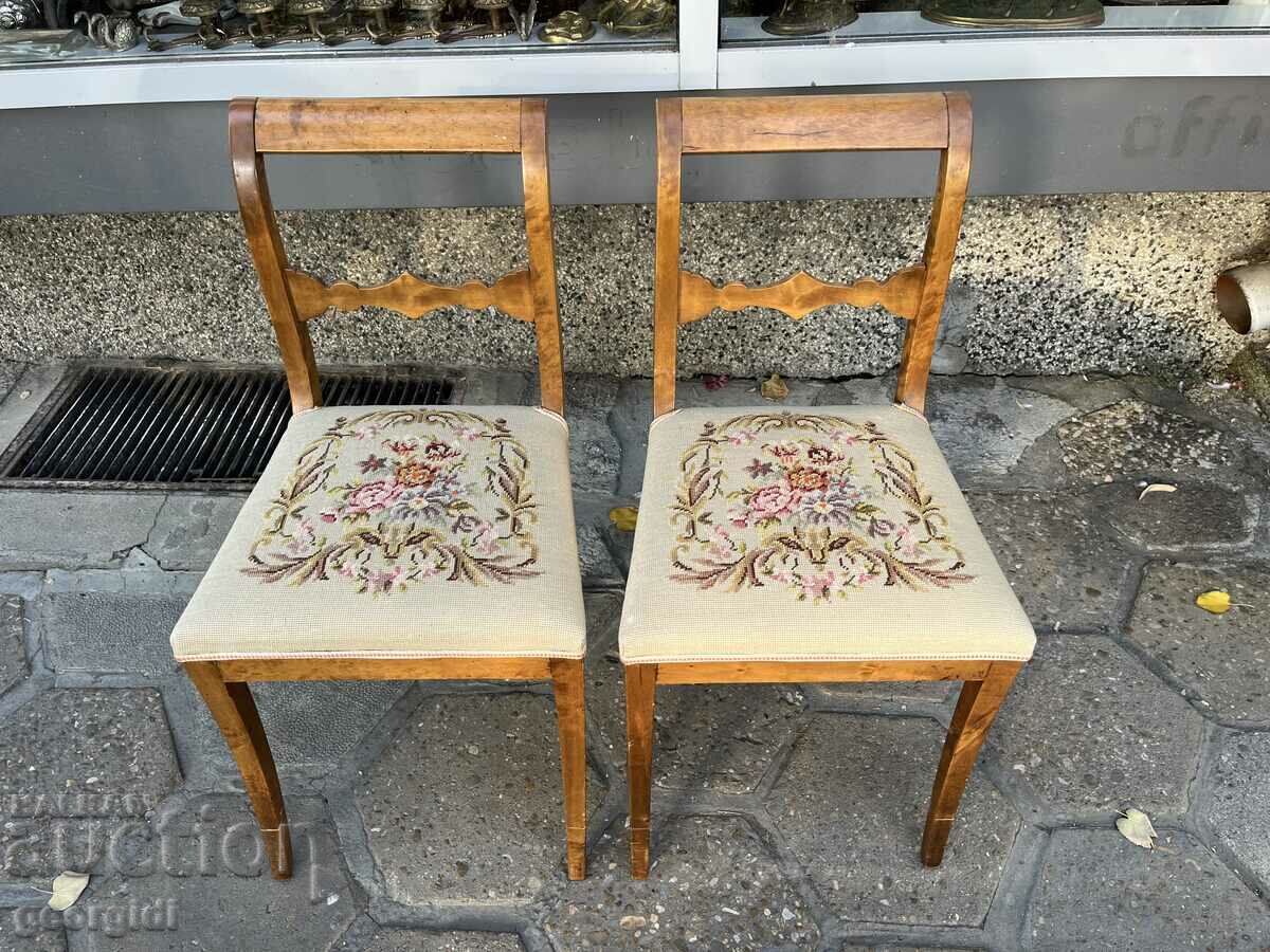 A pair of mahogany chairs with embroidery. #6019