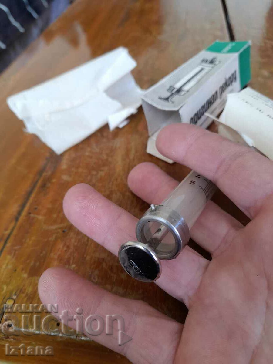 Delivery of Old glass syringe Original Record