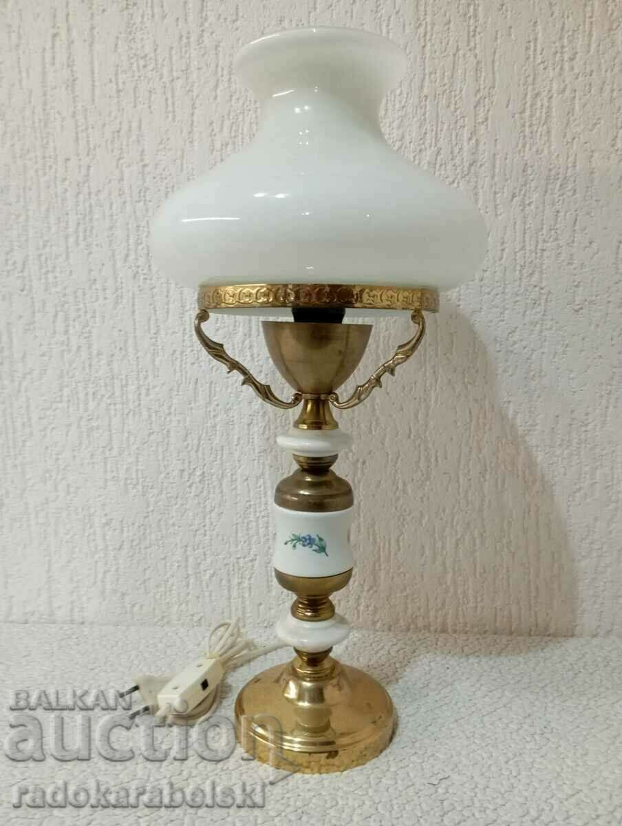 A beautiful vintage lamp with a white glass shade