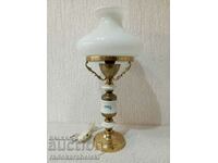 A beautiful vintage lamp with a white glass shade