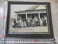 Old cardboard photo of a group of Bulgarians in America