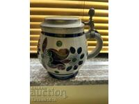 Porcelain and pewter beer mug.