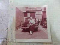 Old photo of a woman in front of the car in America - 2