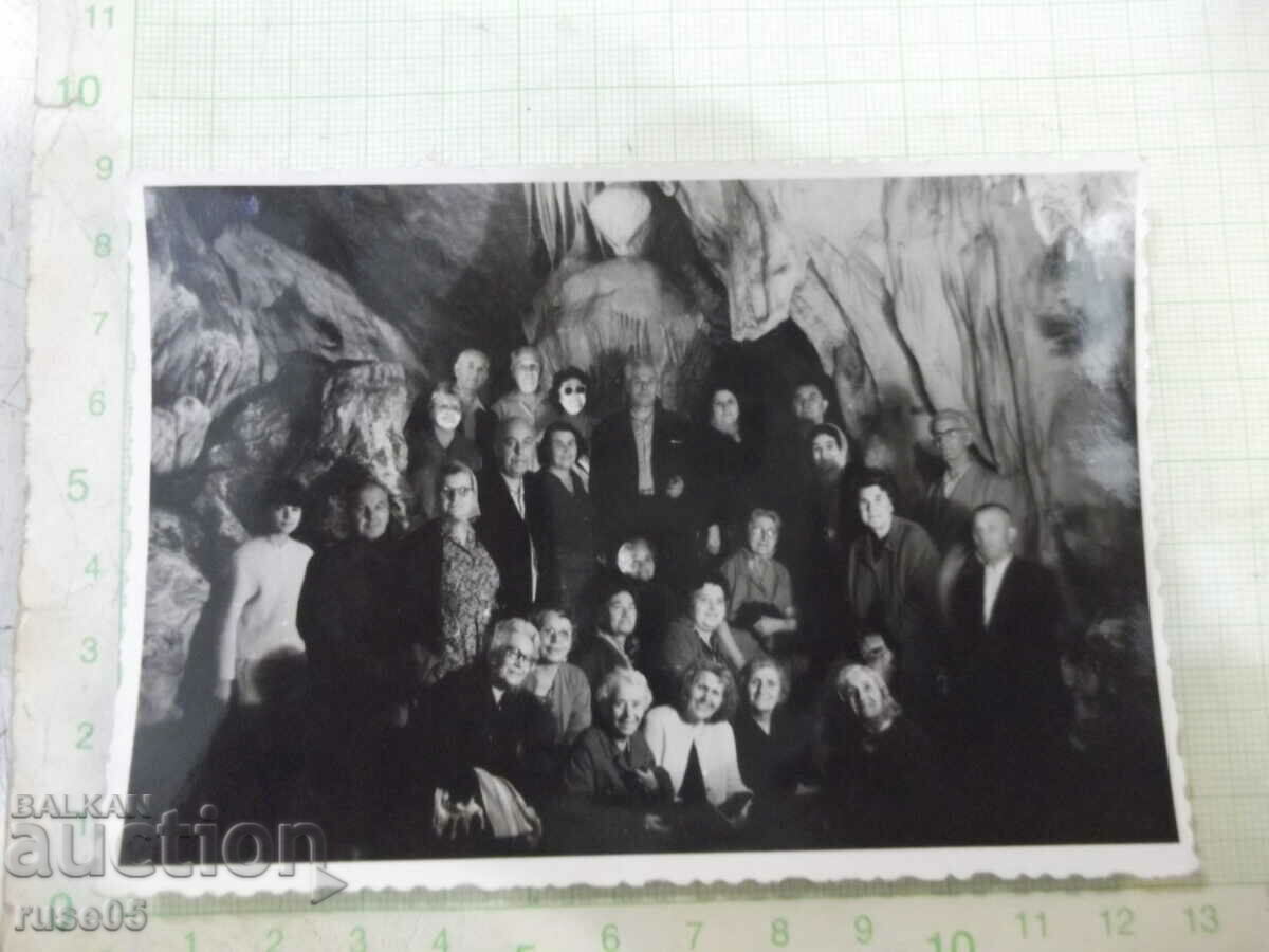 Old photo of a group on a trip to the cave