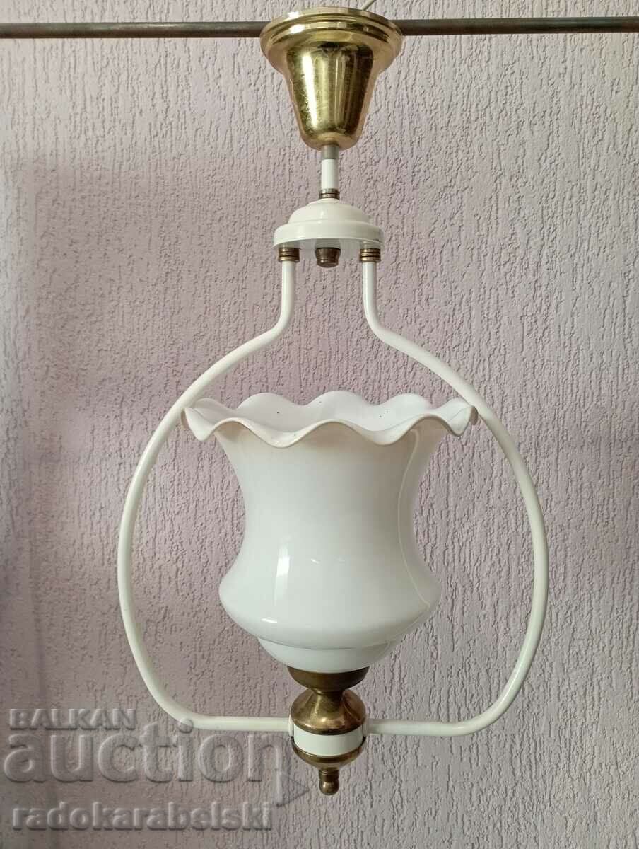 A beautiful white chandelier with a white glass shade