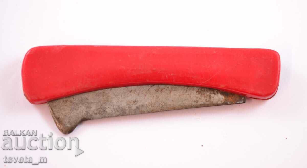 Fruit knife with a red handle