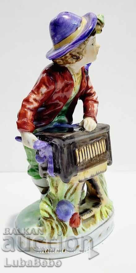 Porcelain figurine street musician with monkey. with price 95.00 BGN | € 48.57 Porcelain figurine street musician with monkey. with price 95.00 BGN | € 48.57