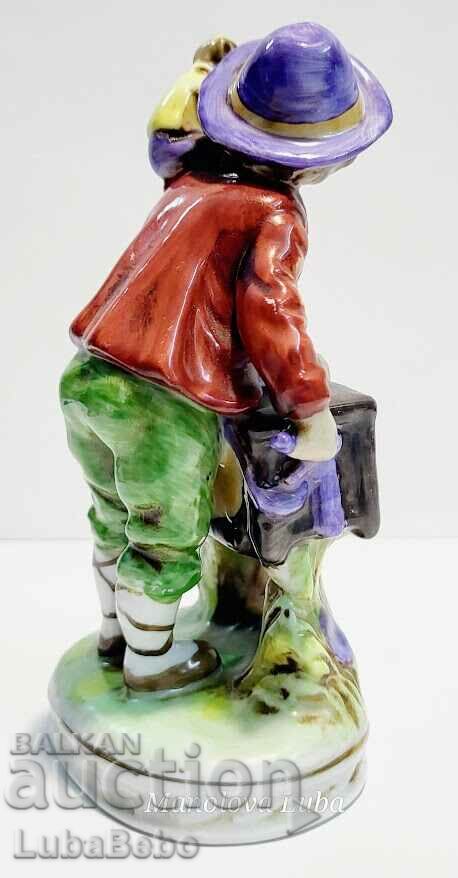 Auction Porcelain figurine street musician with monkey. Auction Porcelain figurine street musician with monkey.