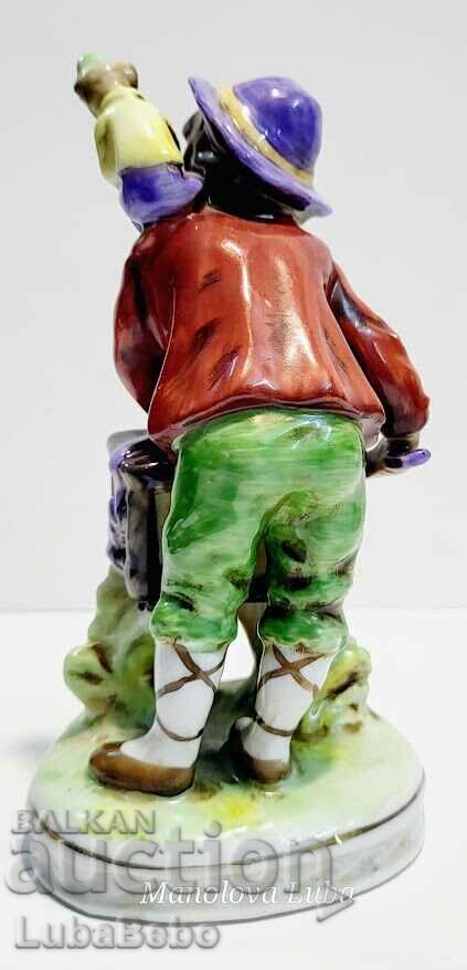 Delivery of Porcelain figurine street musician with monkey. Delivery of Porcelain figurine street musician with monkey.